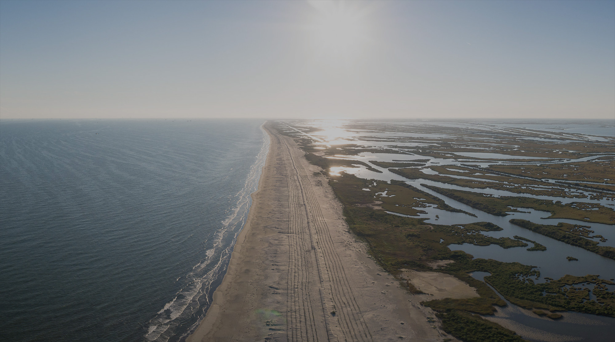 Aerial view of our coast with wetlands behind it